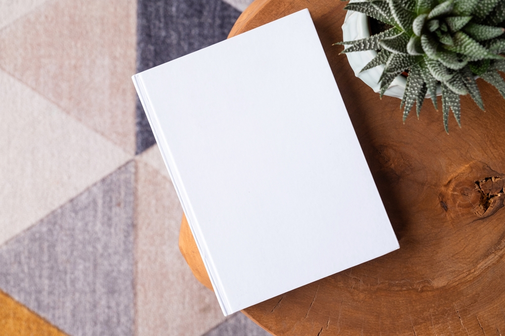 blank,book,mockup,on,coffee,table,with,decorations,and,colorful